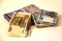 Банкноты российских рублей и тенге